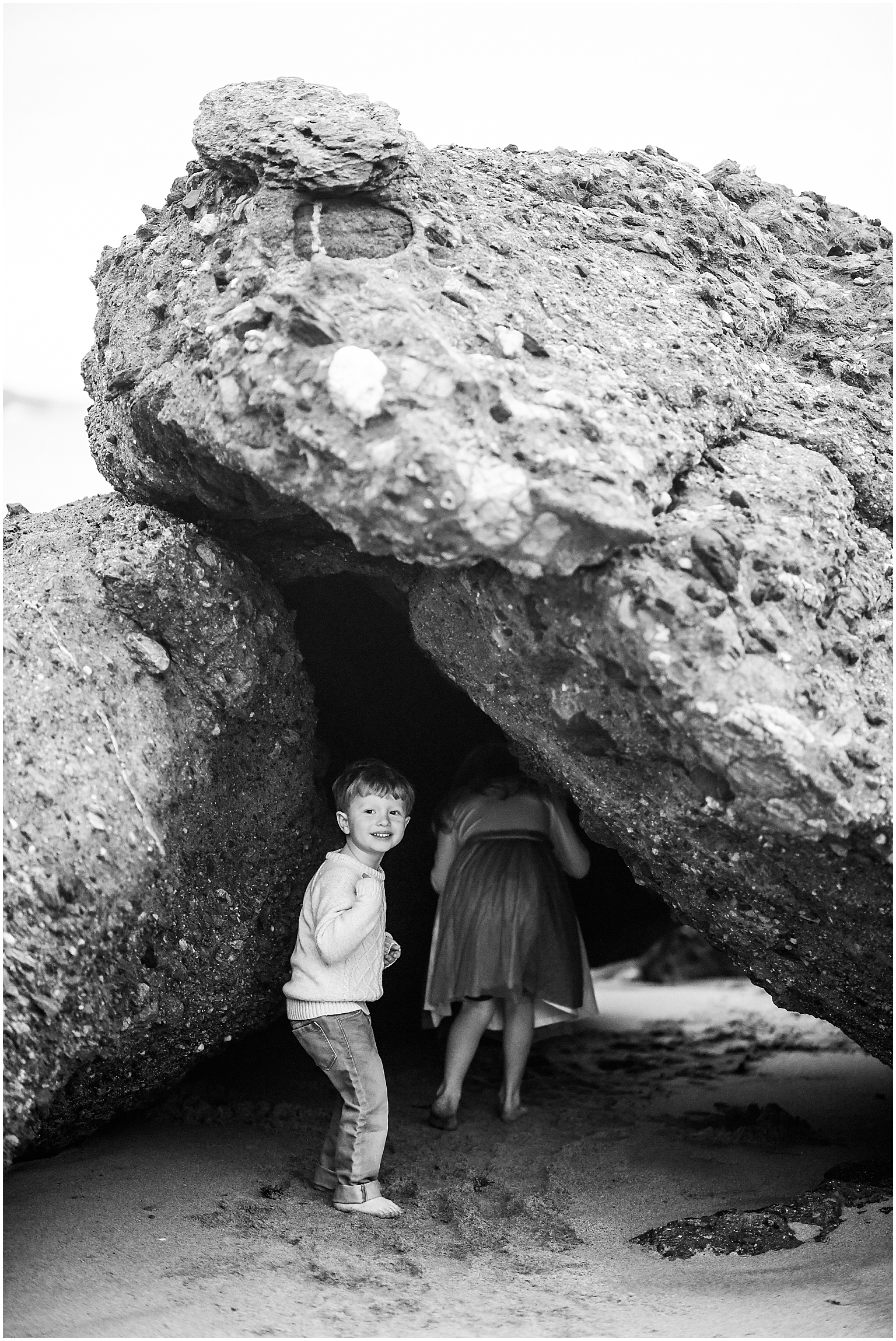 little kids explore a Laguna Beach cave